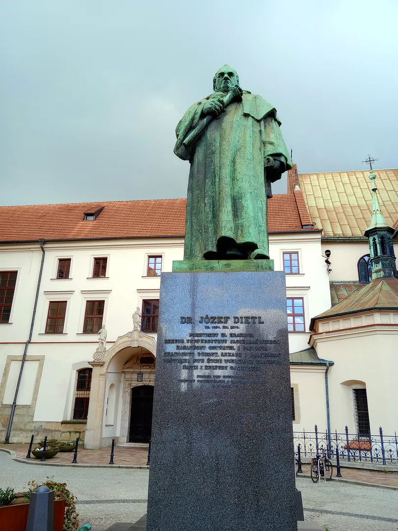 The bronze figure above its inscribed base at Józef Dietl monument