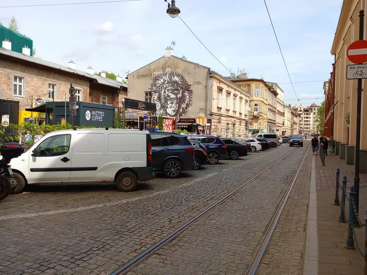 The approach past the surrounding buildings at Judah mural