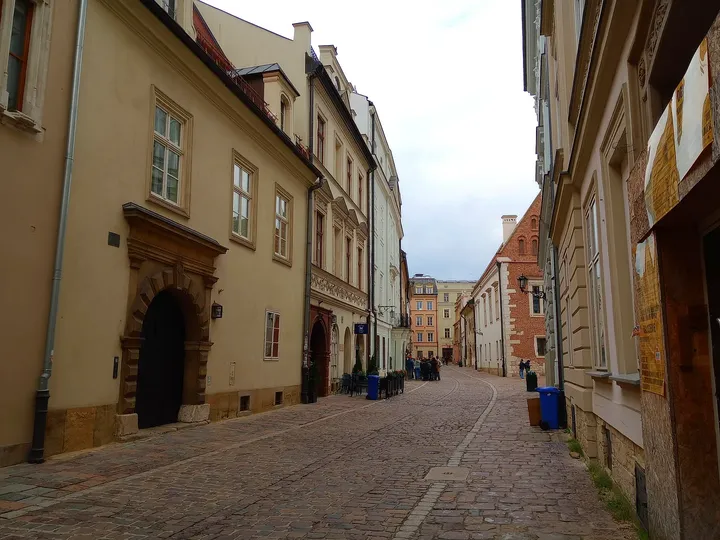 Narrow street between historic houses at Kanonicza Street