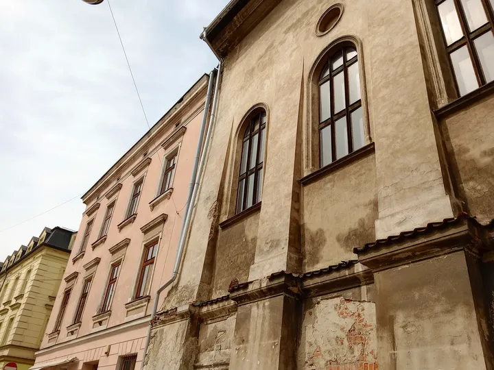 A doorway beside the historic façade at Kazimierz Jewish heritage trail