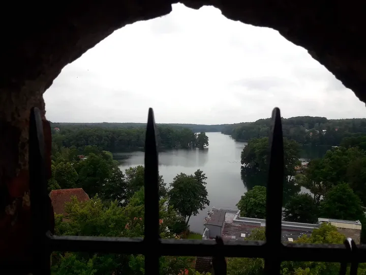 Water beyond an arched window at Knights Hospitaller Castle, Łagów