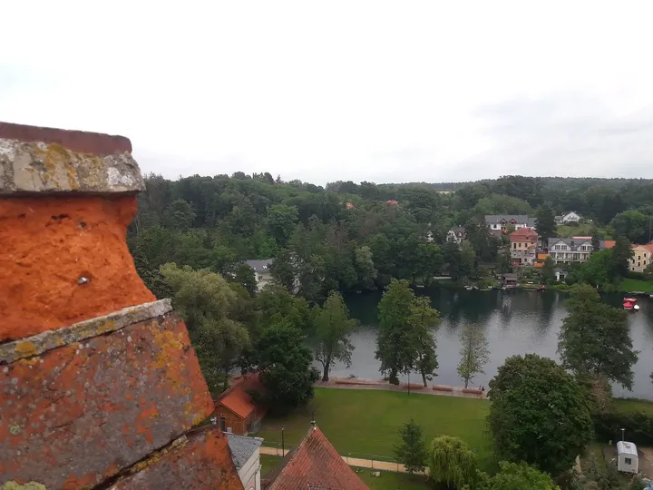 Village roofs beside the lake at Knights Hospitaller Castle, Łagów