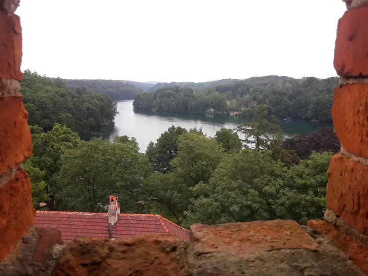 Lake and roofs below the tower at Knights Hospitaller Castle, Łagów