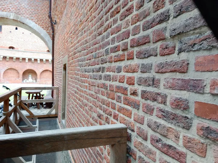 Brickwork and an interior railing at Kraków Barbican