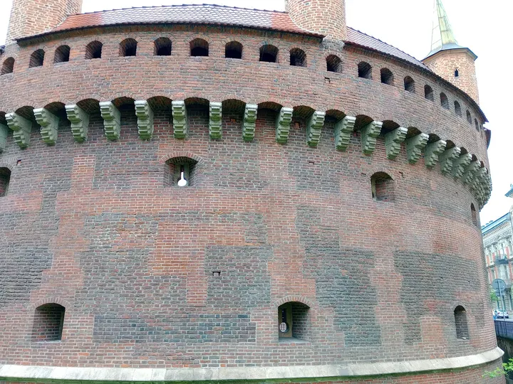 Rows of openings in the rounded wall at Kraków Barbican