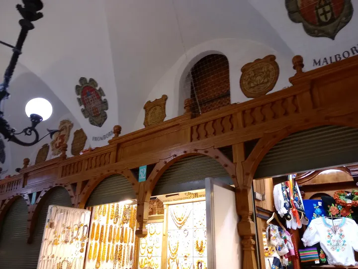 The timber shopfronts beneath the vault at Kraków Cloth Hall