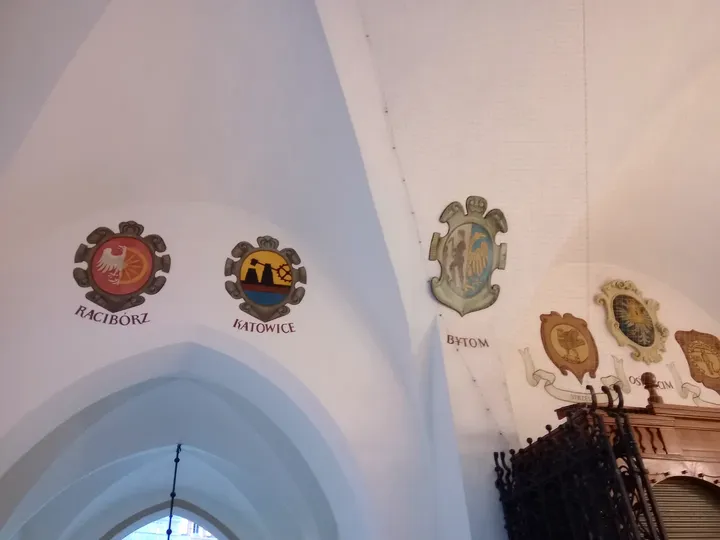 Coats of arms above an arch at Kraków Cloth Hall