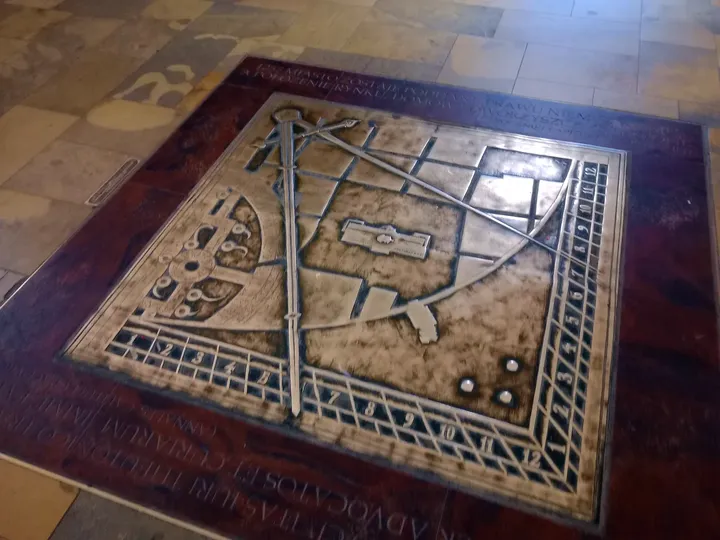 An inscribed floor tablet at Kraków Cloth Hall
