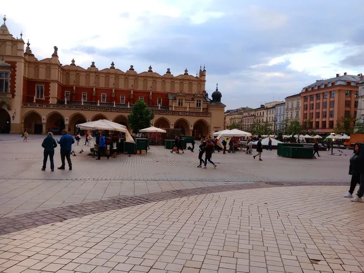 The long market façade across the paving at Kraków Cloth Hall