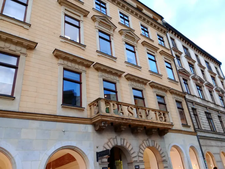 Upper windows above a restaurant entrance at Kraków Main Market Square