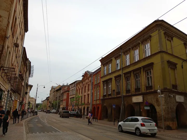 Long yellow frontage across the tracks at Krakowska Street
