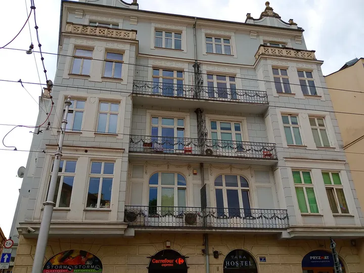 Upper windows on the corner building at Krakowska Street