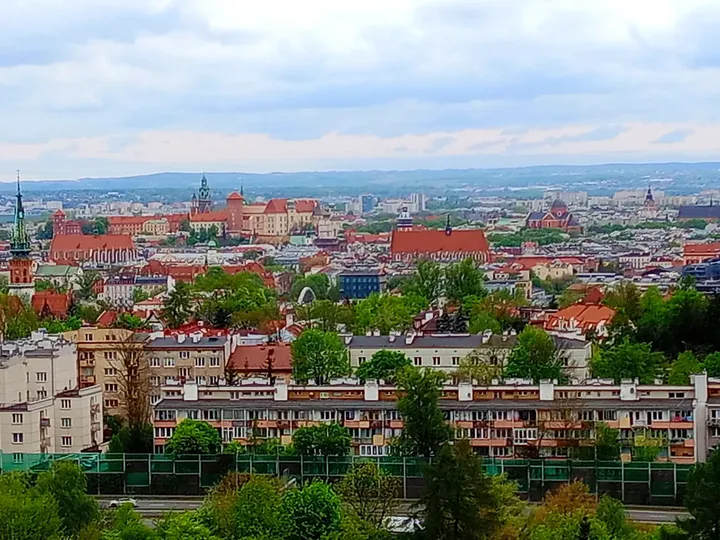 A closer view of roofs beyond the hill at Krakus Mound