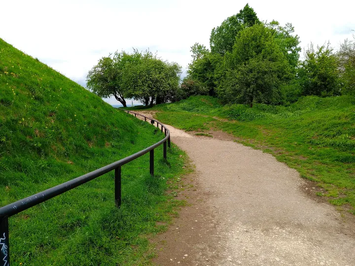 The path climbing the grassy slope at Krakus Mound