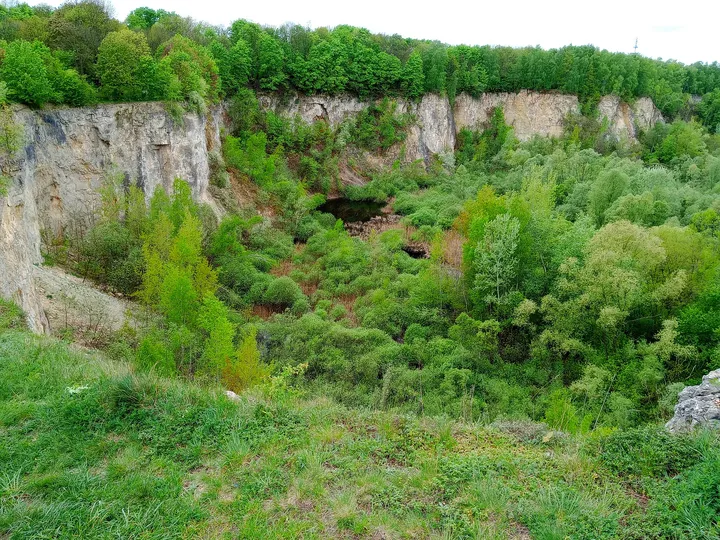 Industrial structures beneath the cliffs at Liban Quarry
