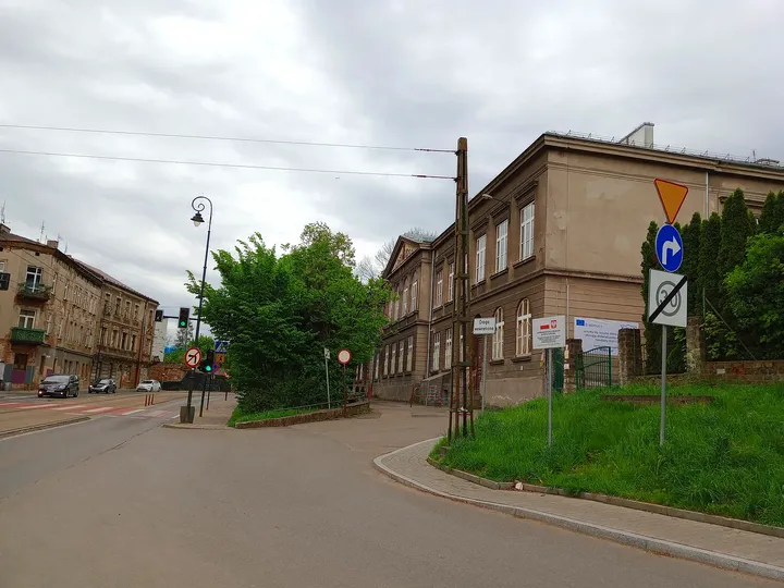 The street approaching the wider junction at Limanowskiego Street