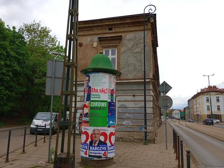A notice column beside the tram route at Limanowskiego Street
