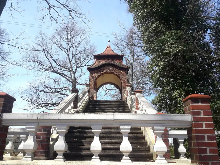 A stone balustrade beside brickwork at Manor Park, Iłowa