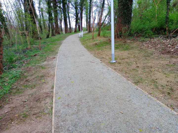 Curving gravel path through the grounds at Manor Park, Świdnica