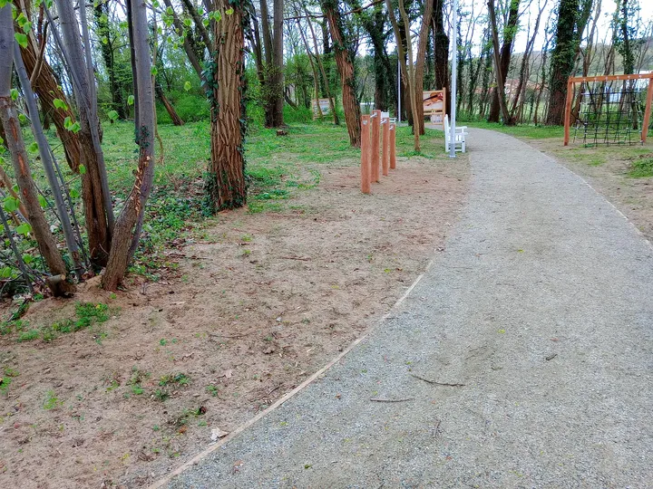 White bench at a path junction at Manor Park, Świdnica