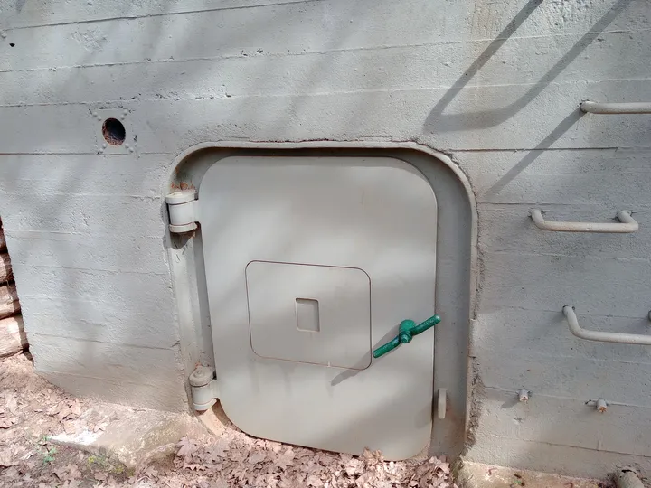 Heavy metal door in the bunker entrance at Międzyrzecz Fortified Region
