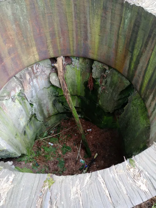 Round concrete opening viewed from above at Międzyrzecz Fortified Region