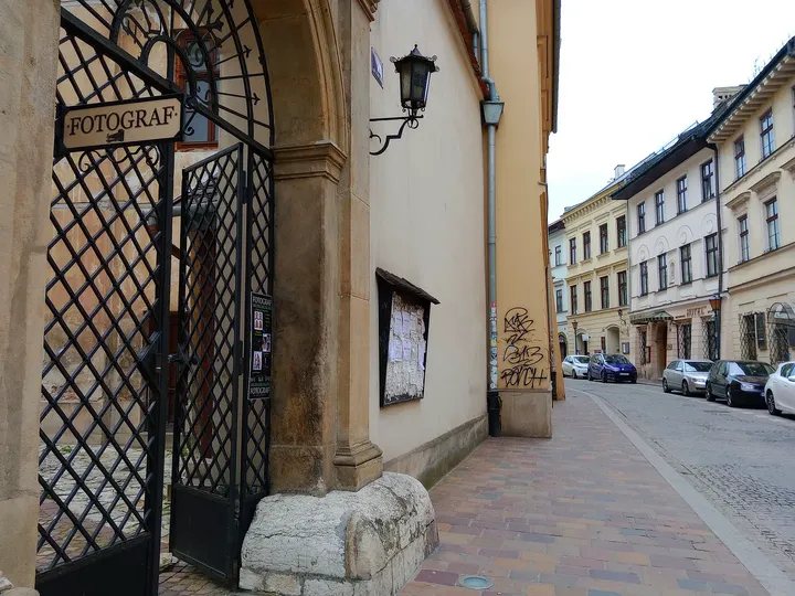 A grille at a street-level doorway at Mikołajska Street