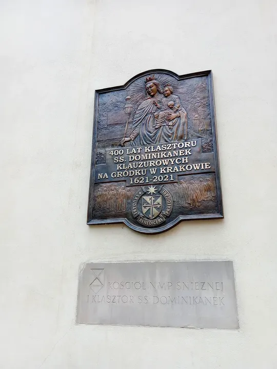 Inscribed tablets on the building wall at Mikołajska Street