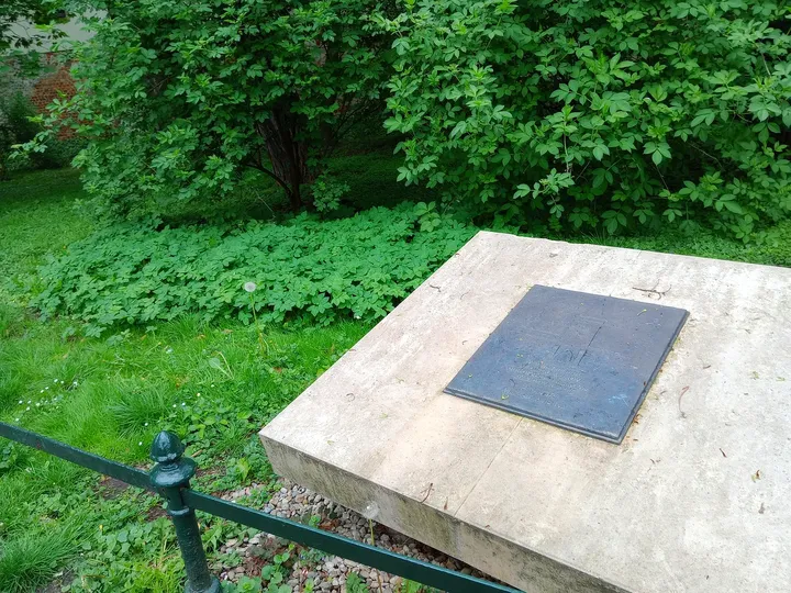An inscribed stone at the park edge at Mikołajska Street