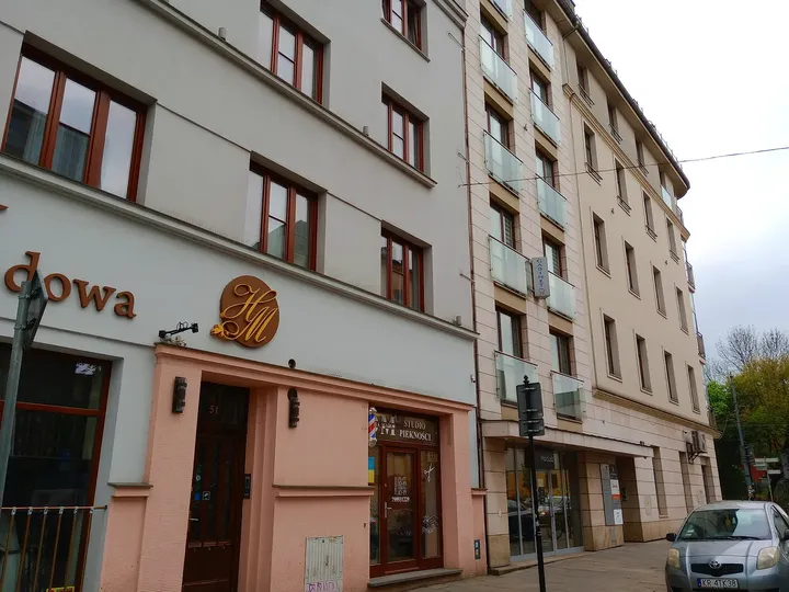 The pavement beside the hotel entrance at Miodowa Street