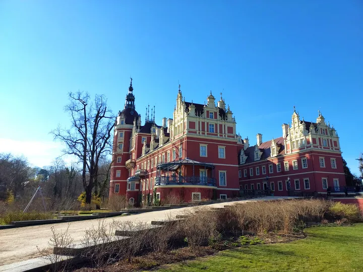 The castle across its waterside setting at New Castle, Bad Muskau