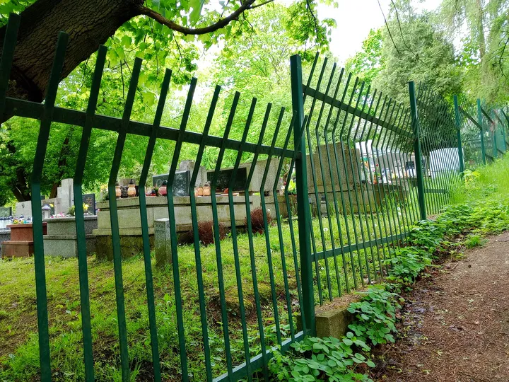 Gate beside the path at the cemetery edge at New Podgórze Cemetery