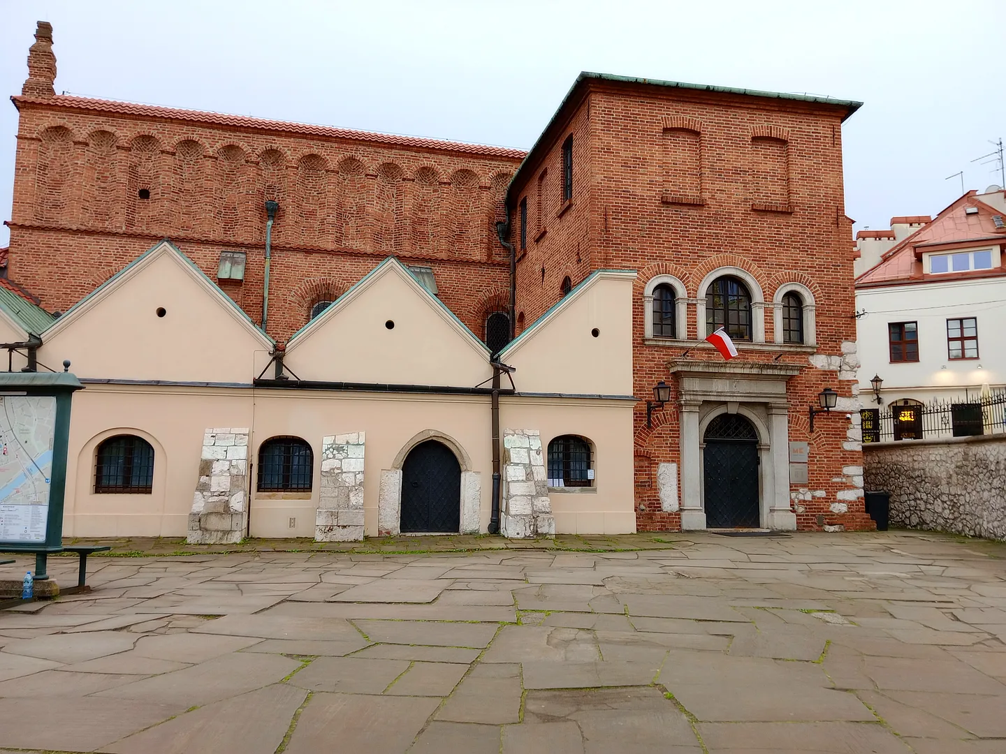 The synagogue across the paved forecourt at Old Synagogue, Kraków