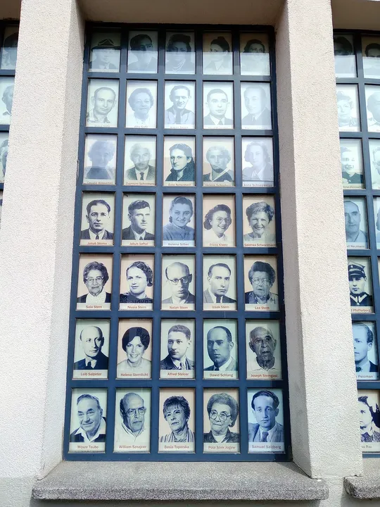 Portrait photographs in a factory window at Oskar Schindler’s Enamel Factory