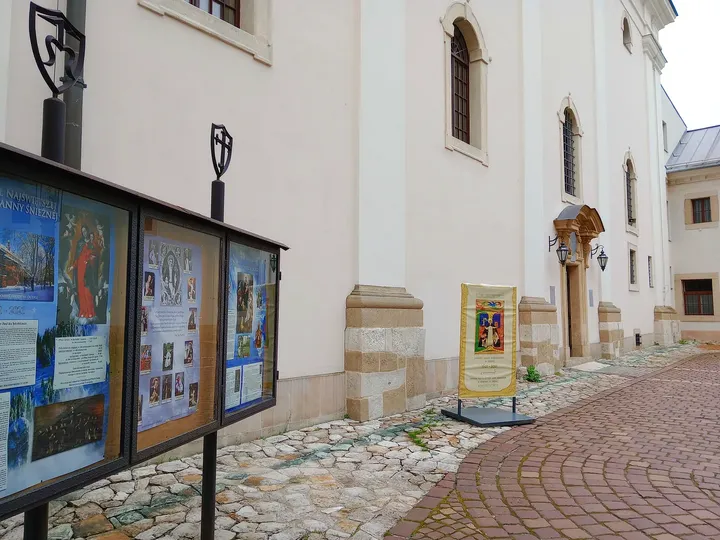 A display beside the courtyard entrance at Our Lady of the Snows Church, Kraków