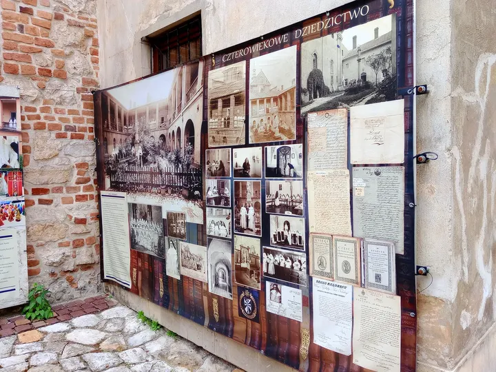 Photographs displayed beside the entrance at Our Lady of the Snows Church, Kraków
