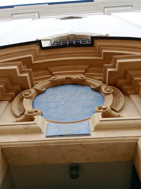 A tablet above the doorway at Our Lady of the Snows Church, Kraków