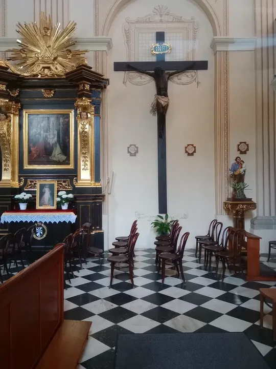 The tiled aisle towards the altar at Our Lady of the Snows Church, Kraków