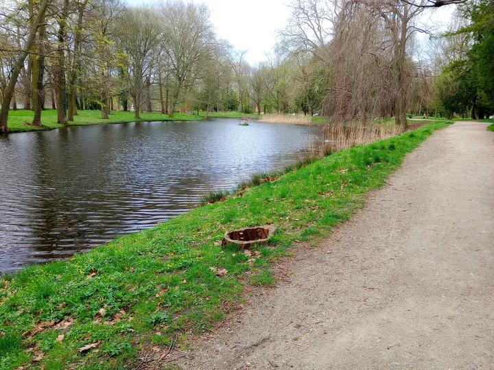 Riverside path beside the water at Palace Park, Żagań