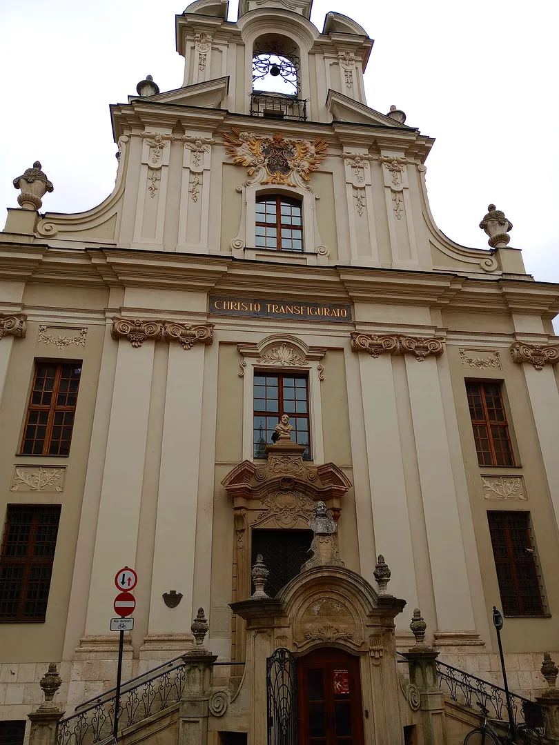The pale church façade at Piarist Church of the Transfiguration