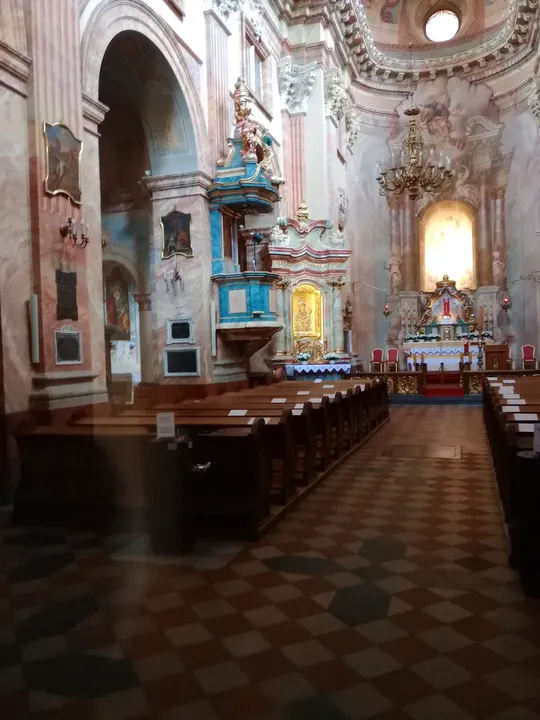 The tiled aisle towards the altar at Piarist Church of the Transfiguration
