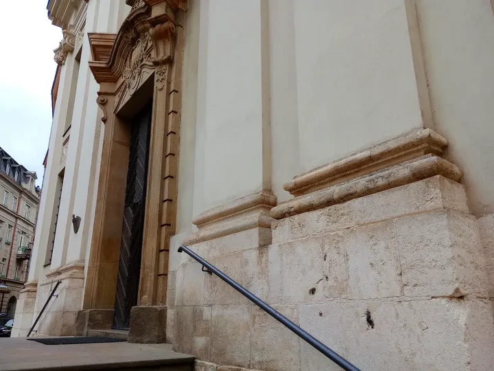 Stone decoration beside the doorway at Piarist Church of the Transfiguration