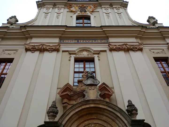 The upper façade above Pijarska Street at Piarist Church of the Transfiguration