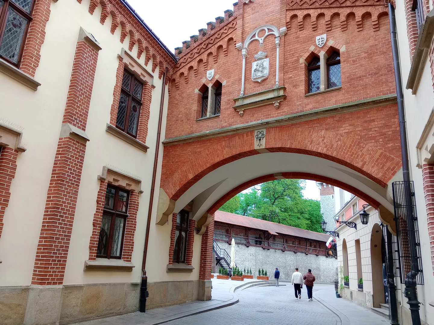Arched bridge across the street at Pijarska Street