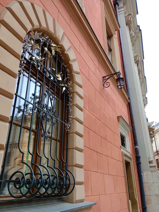 Close view of the iron window surround at Pijarska Street