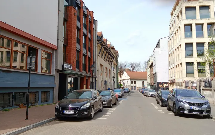 Street leading towards the nearby square at Plac Izaaka street food square