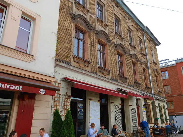 Restaurant frontage along the pavement at Plac Izaaka street food square