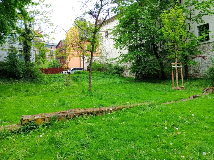 Open lawns beside city buildings at Planty beside Westerplatte Street