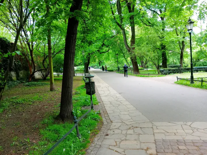 A side path beneath spring foliage at Planty: Florianka Garden