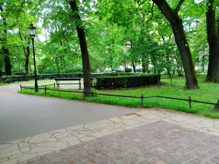 Benches beside the wider avenue at Planty: Florianka Garden